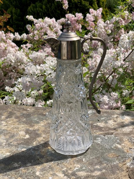 A Cut Glass and Silver Plated Claret Jug with Hooped Handle