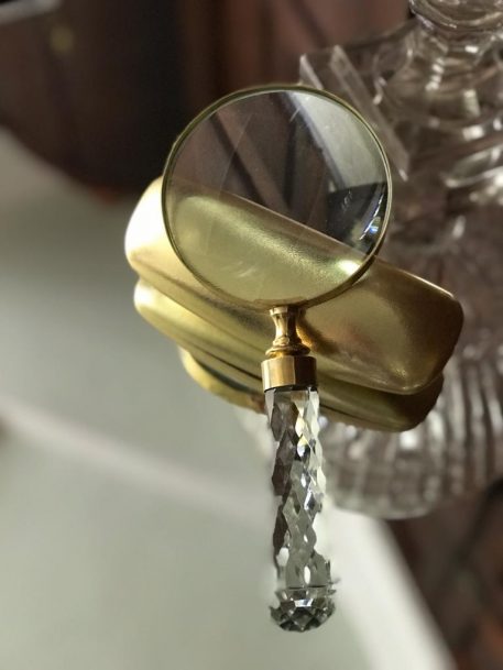 A Large Cut Glass Handle Magnifying Glass with Brass Outer Ring and Trim