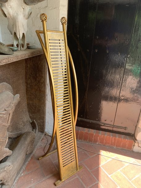 Gilt coloured and stylish metal CD Rack