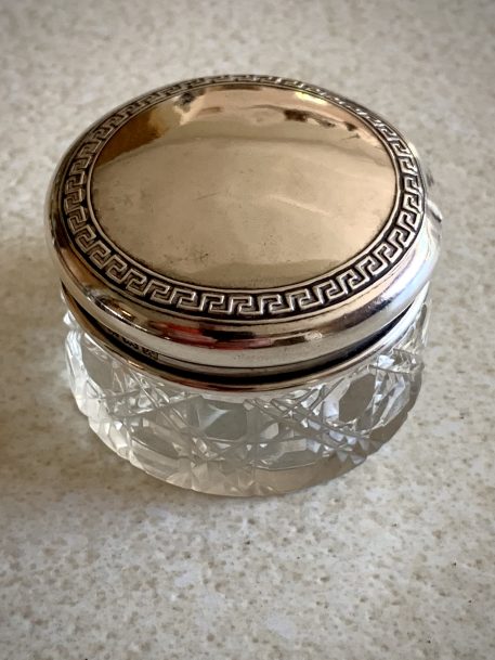 A cut glass vanity jar with silver lid, hallmarked 1922 by S. Blanckensee & Son Ltd.