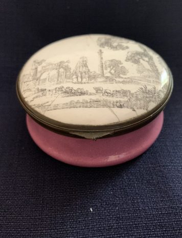 An Antique Bilston Enamel Circular Box decorated with a Classical Landscape Lid