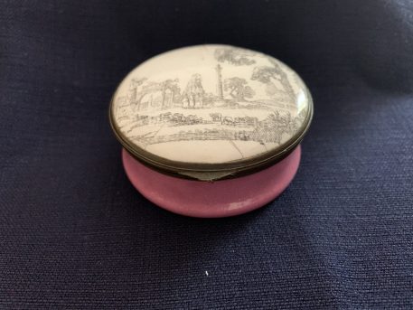 An Antique Bilston Enamel Circular Box decorated with a Classical Landscape Lid