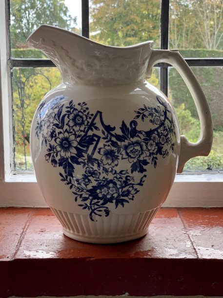A Vintage Blue & White Porcelain Pitcher with floral decorations
