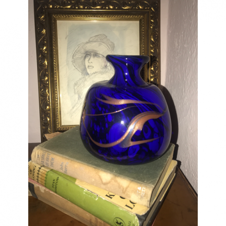 A stunning studio glass vase with cobalt blue and bronze coloured swirl decoration